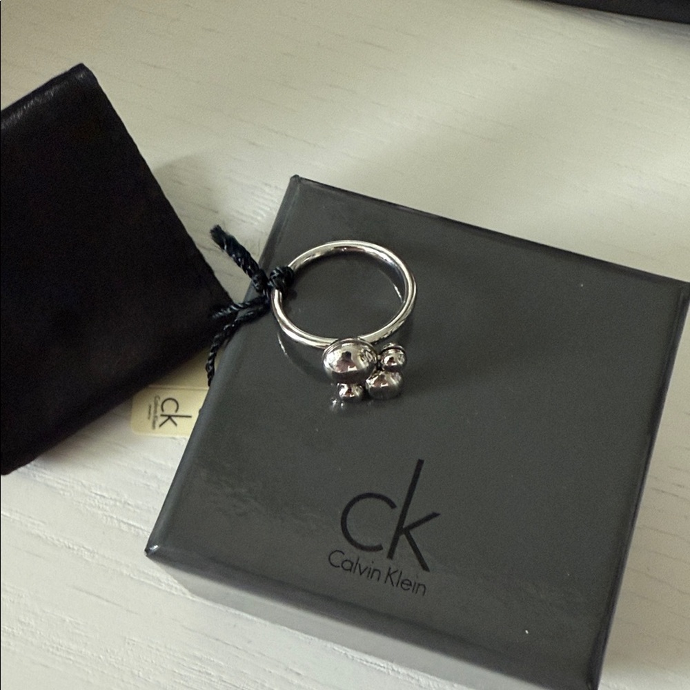 Calvin Klein Metallic Ring with Charms
